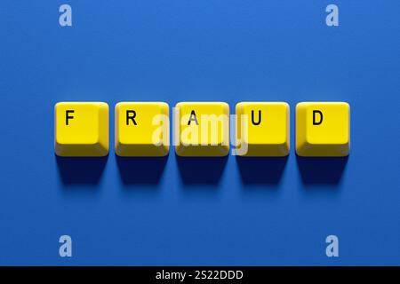 Yellow computer keyboard keys spell fraud on a blue background. Warning about online security risks and cybercrime. Protect personal info and stay ale Stock Photo