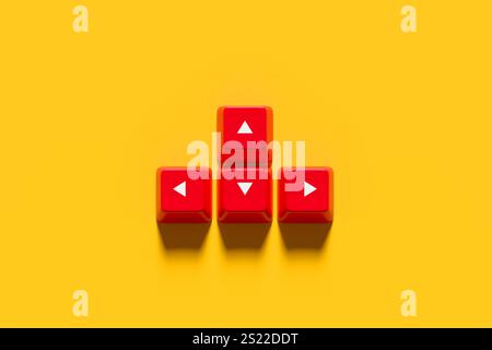 Business direction. Four red keyboard keys with white arrows pointing up, down, left and right arranged on a yellow background are giving directional Stock Photo