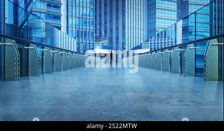 Businessman walking on a modern bridge between office buildings in the financial district. 3D rendering Stock Photo