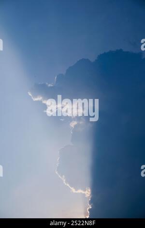 The beauty of sun shines through the clouds. Stock Photo