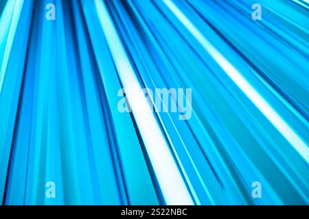 Abstract background showcasing vibrant parallel blue lines converging, creating a dynamic perspective and sense of depth Stock Photo