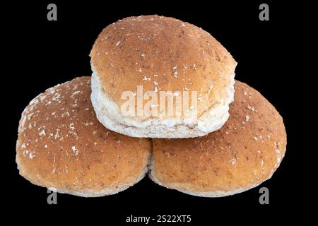 Three Rolls of wheaten and oatmeal on black background Stock Photo