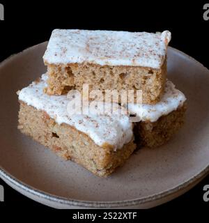 Three slices of Spiced carrot cake on a plate Stock Photo