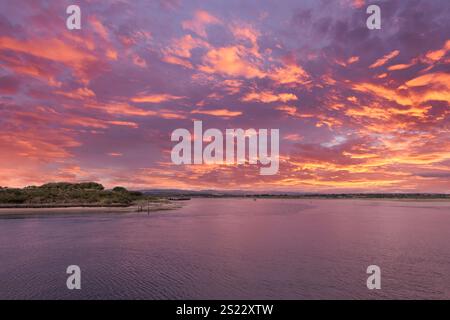 The old harbour at sunset looking over to Ardeer in the far distance at sunset Stock Photo