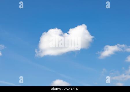 A heart shaped cloud and blue sky Stock Photo