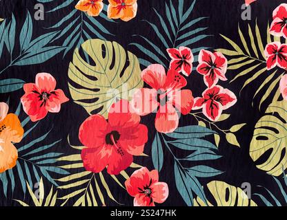 Colorful red hibiscus flower and green palm leaves pattern printed on fabric suitable for clothing. Seamless colorful floral and plant theme fabric ba Stock Photo
