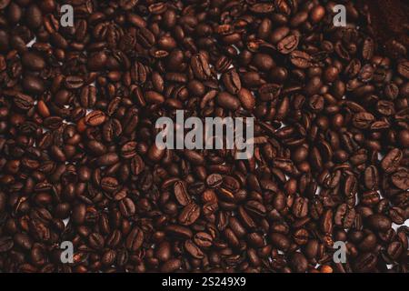 Textured background of freshly roasted coffee beans Stock Photo