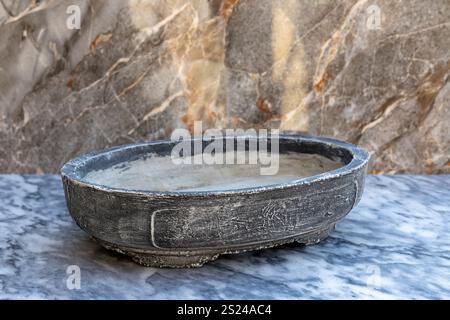 Empty shallow tray in vintage style container for growing bonsai tree. Stock Photo