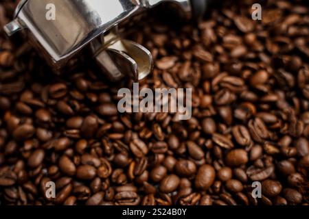 Holder for the coffee machine. Horn espresso coffee maker. Coffee beans. Ground coffee. Stock Photo