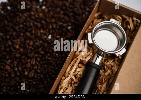 Holder for the coffee machine. Horn espresso coffee maker. Coffee beans. white background. Stock Photo