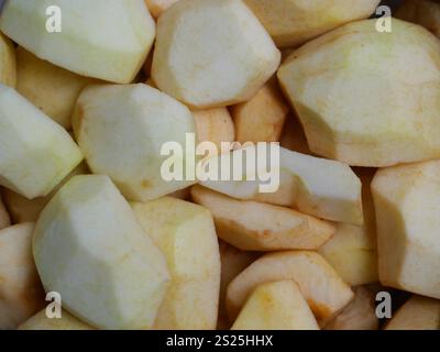 A bowl full of apple pieces, ready to be made into delicious fall dishes. Stock Photo
