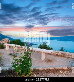 View from observation area on sea sunset picturesque sky and Croatian islands  (near Viganj village, Pelješac  peninsula, Croatia) and Korcula village Stock Photo