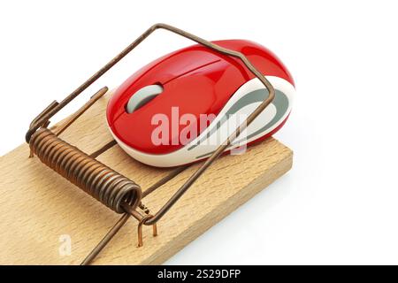 The mouse of a computer in a mousetrap. Symbolic photo for cost trap, debt trap and roaming charges. Austria Stock Photo