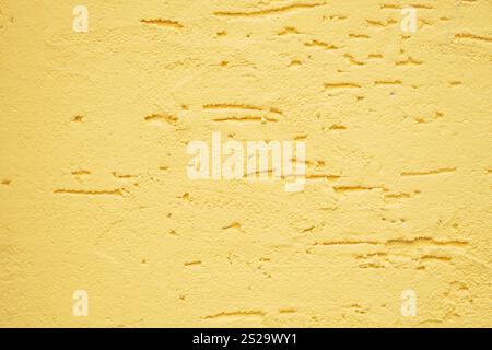 A beautifully textured yellow wall showcasing subtle and elegant patterns Stock Photo