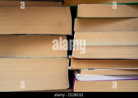 Front close-up view of stacked books and their pages Stock Photo