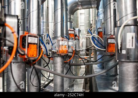 Industrial HVAC System with Automated Controls, Wiring, and Metal Ductwork in a Technical Environment Stock Photo