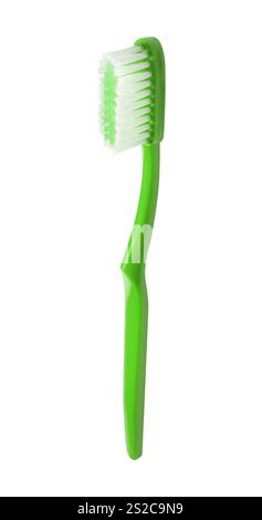 Green plastic toothbrush isolated over white Stock Photo