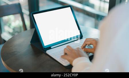 Blank screen tablet with white background for advertising text, Woman use tablet and  looking at it, Woman using tablet contact business search inform Stock Photo