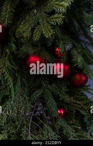Full frame close-up of a Christmas tree decorated with red Christmas baubles Stock Photo