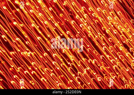 Orange and yellow colored long exposure holiday lights abstract background Stock Photo