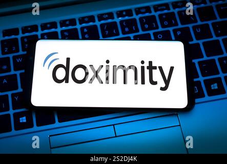Doximity logo displayed on mobile device Stock Photo