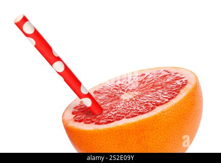 Half of grapefruit with drinking straw on white background. Organic juice or freshly made smoothie concept Stock Photo