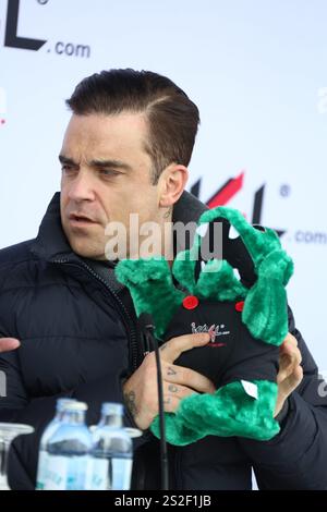 Robbie Williams poses during the 