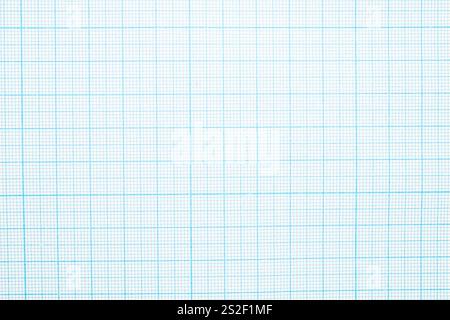 One sheet of graph paper with a plastic ruler, macro, top view. Stock Photo