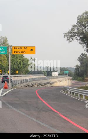 Stop Sign By Ramp Sign on the highway to indicate a braking ramp to stop vehicles that ...