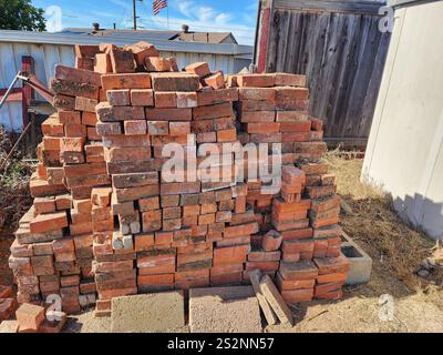 Used bricks stacked and ready for reuse. Stock Photo