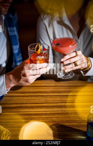 Hands holding cocktail glasses Stock Photo