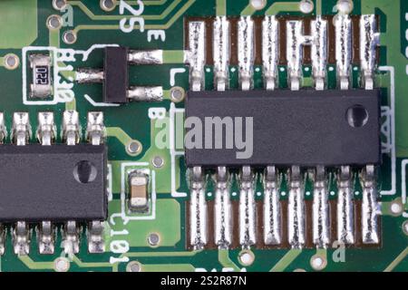 Integrated circuits on green circuit board Stock Photo