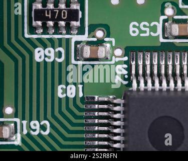 Close up of circuit board with integrated circuit and capacitors Stock Photo