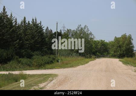 rural gravel road with intersection in summer Stock Photo