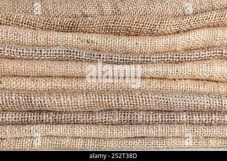 Stack of folded burlap fabric, closeup Stock Photo