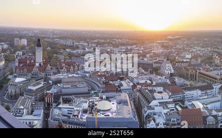 View of the city from the City Tower with evening sun, Neues Rathaus, Johannapark, Petersbogen and Thomaskirche, Leipzig, Saxony, Germany, Europe Stock Photo