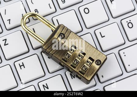 A padlock on a computer keyboard. Symbolic photo for data security and hacking Austria Stock Photo