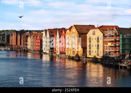 Trondheim, Norway - May 20. 2013: Afternoon sun light over the colorful timber houses at River Nidelva in the Brygge district of Trondheim, Norway Stock Photo