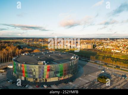 Siauliai, Lithuania - 12th november, 2024: aerial view Siauliai arena panorama with city buildings outside in sunny autumn day. Hosts basketball games Stock Photo