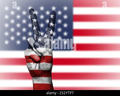 victory sign in front of a United States of America flag Stock Photo