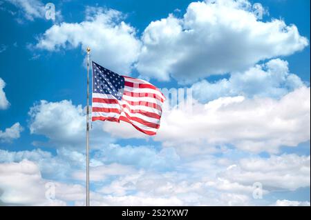 United States of America flag waving on a blue and sunny sky Stock Photo