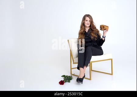 Human skeleton in suit using laptop at table and woman waiting on chair in office. High quality photo Stock Photo