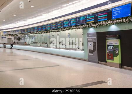 Ticket sellers, ticket selling machine and departure schedules in the Long Island Railroad section of Grand Central Madison in Midtown Manhattan. Stock Photo