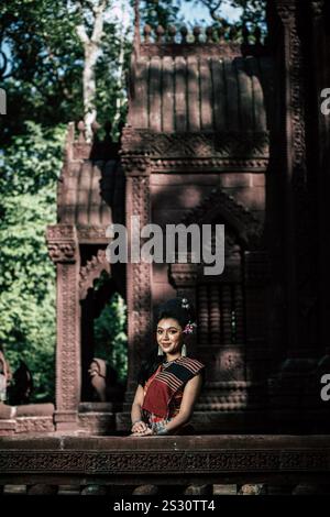 Young female Actress wearing beautiful ancient costumes, in ancient monuments, dramatic style. Perform on legend love popular story, Thai Isan folktal Stock Photo