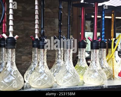 Various colors of hookah or shisha, which is a traditional tool for smoking tobacco mixed with various fruit or spice flavors Stock Photo