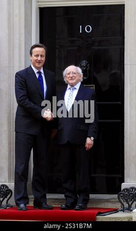 Britain's Prime Minister David Cameron meets Irish President Michael D Higgins at 10 Downing Street on the second day of his historic visit to the UK in London - 09 April 2014 Stock Photo