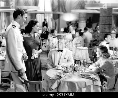 SLATTERY'S HURRICANE [US 1949] JOHN RUSSELL, LINDA DARNELL, RICHARD WIDMARK AND UNIDENTIFIED FLIRTING     Date: 1949 Stock Photo