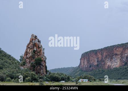 Nakuru, Kenya. 21st Dec, 2024. Fischer's Tower seen at the Hells gate national park, which is about 40meters high, a prominent tooth of rock as one enters at the park in Naivasha, Nakuru county Kenya. Lake Naivasha attracts a variety of animals that include buffalo, antelope, giraffe, warthog and monkey, and you will almost certainly catch sight of hippos lazily watching proceedings from the cooling water. The Lake also plays host to a variety of birdlife; more than 400 species have been recorded here. Many can be spotted along the shoreline ''“ from pelicans and fish eagles to weavers and Stock Photo