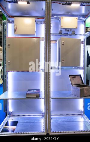 The control panel is equipped with a variety of electrical components to ensure safe and efficient operation of industrial machinery. Stock Photo