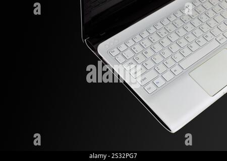 Minimalist White Laptop Keyboard on Black Background Stock Photo